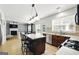 A kitchen view to the living room featuring a center island at 340 Hammersmith Dr, Suwanee, GA 30024