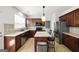 Spacious kitchen with stainless steel appliances, island with seating, and ample counter space at 340 Hammersmith Dr, Suwanee, GA 30024