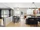Open-concept kitchen and eat in table next to the living area at 340 Hammersmith Dr, Suwanee, GA 30024