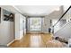 Bright living space with hardwood floors, large windows, and neutral decor offers a cozy atmosphere at 340 Hammersmith Dr, Suwanee, GA 30024