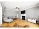 Spacious living room featuring hardwood floors, fireplace, and ample seating at 340 Hammersmith Dr, Suwanee, GA 30024