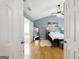 Bright bedroom with vaulted ceilings, ensuite bathroom, and hardwood floors at 340 Hammersmith Dr, Suwanee, GA 30024
