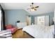 Spacious main bedroom showing vaulted ceilings, a ceiling fan, and attached bath at 340 Hammersmith Dr, Suwanee, GA 30024