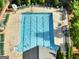 Overhead view of a community swimming pool with several people enjoying the water at 340 Hammersmith Dr, Suwanee, GA 30024
