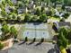 Community tennis courts with parking, mature trees, and well-maintained landscaping at 340 Hammersmith Dr, Suwanee, GA 30024