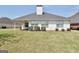 Well-maintained backyard featuring a patio, lush green lawn, and mature landscaping, perfect for outdoor enjoyment at 1313 Jubilee Ln, Mcdonough, GA 30253