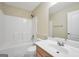 Bathroom featuring a shower/tub combo, large mirror, toilet, and light-colored vanity at 1313 Jubilee Ln, Mcdonough, GA 30253