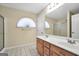 Bathroom featuring double sink vanity, modern fixtures, tile flooring, and a glass-enclosed shower at 1313 Jubilee Ln, Mcdonough, GA 30253