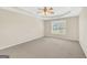 Bedroom with neutral carpet and paint, a ceiling fan, and a window at 1313 Jubilee Ln, Mcdonough, GA 30253