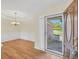 Inviting foyer with hardwood floors, opening to a dining area, and a view of the exterior, with natural light at 1313 Jubilee Ln, Mcdonough, GA 30253