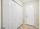 Hallway featuring access to closet and house entrance at 1313 Jubilee Ln, Mcdonough, GA 30253