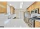 Well-lit kitchen featuring stainless steel appliances, white countertops, and light wood cabinetry at 1313 Jubilee Ln, Mcdonough, GA 30253