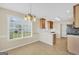 Bright kitchen features light-colored cabinets, white countertops, and a large window for natural light at 1313 Jubilee Ln, Mcdonough, GA 30253