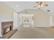 Spacious living room features a fireplace, carpet floors, and access to the kitchen and sunroom at 1313 Jubilee Ln, Mcdonough, GA 30253