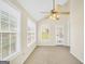 Bright sunroom filled with natural light from large windows and offering a ceiling fan at 1313 Jubilee Ln, Mcdonough, GA 30253