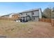 Spacious backyard featuring a covered patio, outdoor furniture, and a wooden fence perimeter at 3541 Stoneleigh Walk, Lithonia, GA 30038
