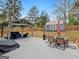 Backyard with a covered patio, outdoor seating, and a view of the shed and fenced yard at 3541 Stoneleigh Walk, Lithonia, GA 30038