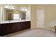Bathroom with a double sink vanity, tile floors, and a large mirror at 3541 Stoneleigh Walk, Lithonia, GA 30038
