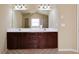 Bathroom with a double sink vanity, tile floors, and a large mirror at 3541 Stoneleigh Walk, Lithonia, GA 30038
