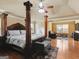 Spacious bedroom with a large bed, ceiling fan, and hardwood floors at 3541 Stoneleigh Walk, Lithonia, GA 30038