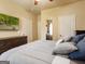 Bedroom featuring TV, dresser, mirror, and grey color scheme throughout at 3541 Stoneleigh Walk, Lithonia, GA 30038