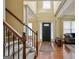 Welcoming foyer featuring hardwood floors, a staircase, and plenty of natural light at 3541 Stoneleigh Walk, Lithonia, GA 30038