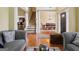 Cozy living room with hardwood floors, a staircase, and an open view to dining area at 3541 Stoneleigh Walk, Lithonia, GA 30038