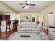 View of kitchen island from the living room with barstool seating and stainless steel appliances at 3541 Stoneleigh Walk, Lithonia, GA 30038