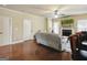 Relaxing living room with hardwood floors, fireplace, and access to the kitchen and hallway at 3541 Stoneleigh Walk, Lithonia, GA 30038