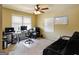 A functional office space featuring computer set up, natural light, and comfortable seating at 3541 Stoneleigh Walk, Lithonia, GA 30038