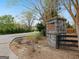Neighborhood signage for Crestview Manor featuring stone and well-maintained landscaping at 3541 Stoneleigh Walk, Lithonia, GA 30038
