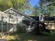 Charming single-story home with a covered carport, stone accents, and well-maintained landscaping at 1499 Carriage Ln, Jonesboro, GA 30238