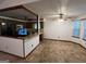 Open-concept kitchen with breakfast bar, wood cabinets, adjacent dining area, and lots of natural light at 1499 Carriage Ln, Jonesboro, GA 30238