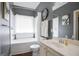 Well-lit bathroom with a tub, a shower, and a classic vanity, ideal for relaxation and convenience at 3417 Double Eagle Dr # Bldg 31, Marietta, GA 30008