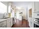Open concept kitchen with breakfast nook, white cabinetry, and modern appliances at 3417 Double Eagle Dr # Bldg 31, Marietta, GA 30008