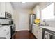 Well-lit kitchen with stainless steel appliances, white cabinets, and hardwood floors at 3417 Double Eagle Dr # Bldg 31, Marietta, GA 30008