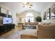 Spacious living room featuring vaulted ceilings, a ceiling fan, and a cozy sectional sofa at 3417 Double Eagle Dr # Bldg 31, Marietta, GA 30008