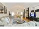 Spacious living room open to dining area, featuring hardwood floors and modern furnishings at 3417 Double Eagle Dr # Bldg 31, Marietta, GA 30008