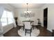 Charming dining room with natural light, a stylish chandelier, and seating for four at 316 Trulove Lane Lot 35 # 35, Locust Grove, GA 30248