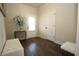 Bright entryway with a white door, wood floors, a decorative bench, and stylish accents at 316 Trulove Lane Lot 35 # 35, Locust Grove, GA 30248
