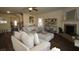 Comfortable living room featuring a fireplace, modern decor, and hardwood floors at 316 Trulove Lane Lot 35 # 35, Locust Grove, GA 30248