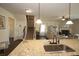 Open floor plan with kitchen island view, stairs, and a living room with a fireplace at 316 Trulove Lane Lot 35 # 35, Locust Grove, GA 30248