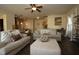 Comfortable living room with hardwood floors, plush seating, and a decorative ceiling fan at 316 Trulove Lane Lot 35 # 35, Locust Grove, GA 30248