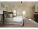 Spacious main bedroom features decorative mirrors, vaulted ceilings, and an en-suite bathroom at 316 Trulove Lane Lot 35 # 35, Locust Grove, GA 30248