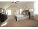 Bright main bedroom with high ceilings, soft carpet, and elegant decor at 316 Trulove Lane Lot 35 # 35, Locust Grove, GA 30248