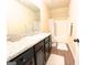 Bathroom with combination tub and shower, granite countertops, wood look flooring and modern fixtures at 328 Trulove Lane Lot 32 # 32, Locust Grove, GA 30248