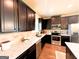 Spacious kitchen featuring dark cabinets, granite counters and stainless appliances at 328 Trulove Lane Lot 32 # 32, Locust Grove, GA 30248