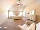 Spacious main bedroom boasting vaulted ceilings, ceiling fan, plush carpeting and a sitting area at 328 Trulove Lane Lot 32 # 32, Locust Grove, GA 30248