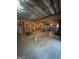 Unfinished basement with exposed framework, offering ample space and potential for customization and future expansion at 135 Danube Trl, Stockbridge, GA 30281