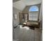 Bright bathroom with a standalone shower and large tub beneath a half-moon window at 135 Danube Trl, Stockbridge, GA 30281
